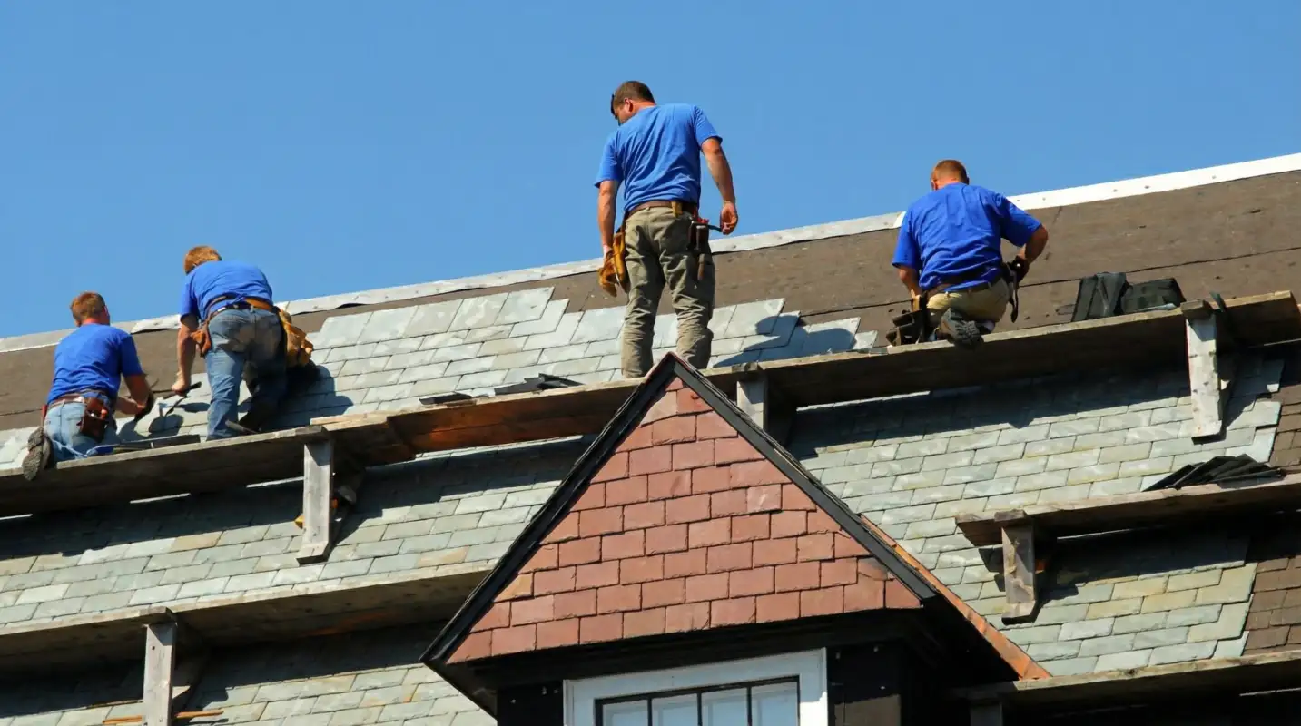 Roof replacement in progress with a team of professional contractors installing new shingles on a residential home in Nashville, TN