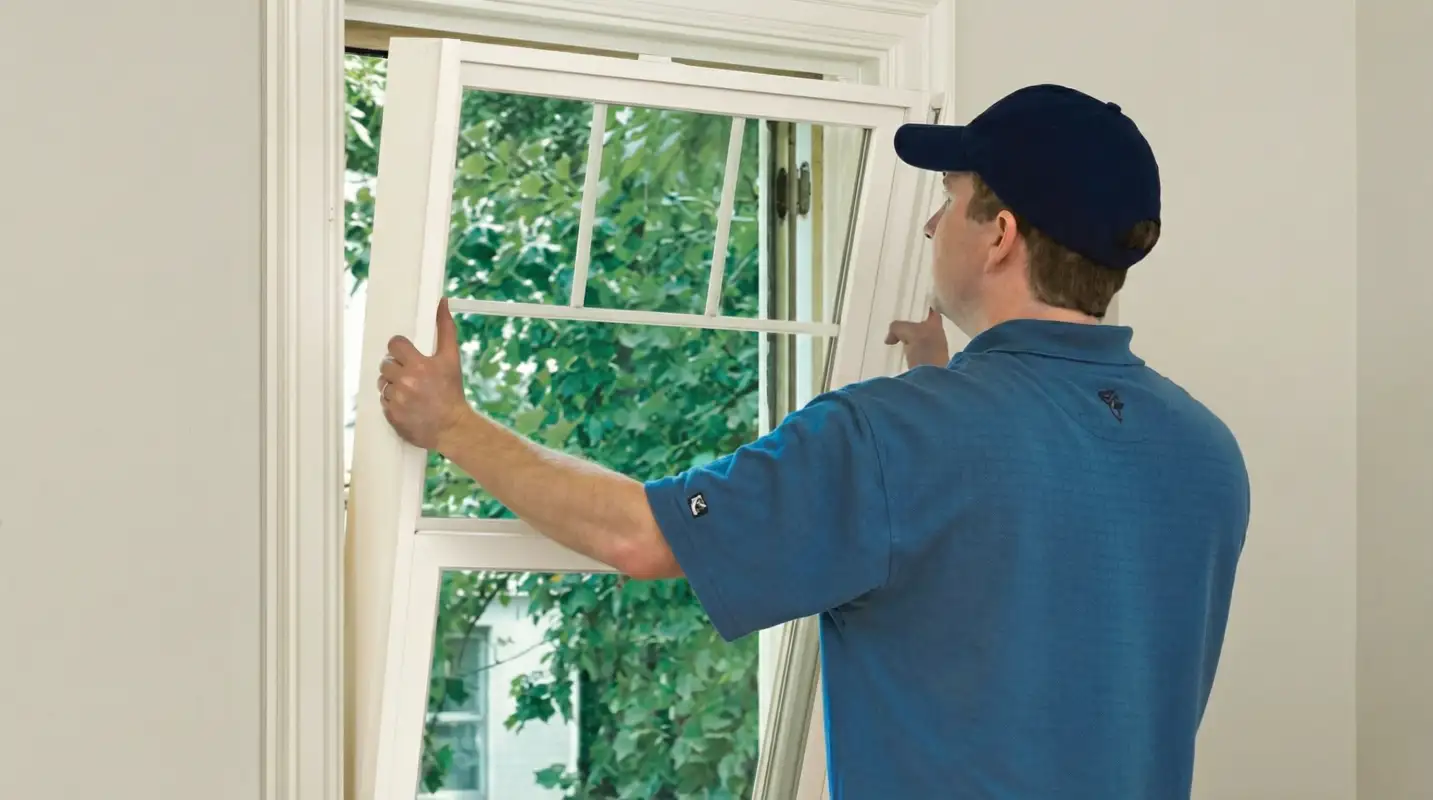 Professional contractors performing a residential window insulation and replacement service in Nashville, TN